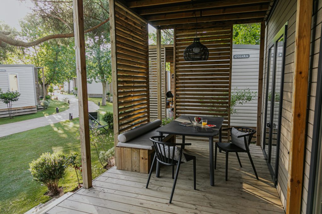 Mobile home with wooden decking and table